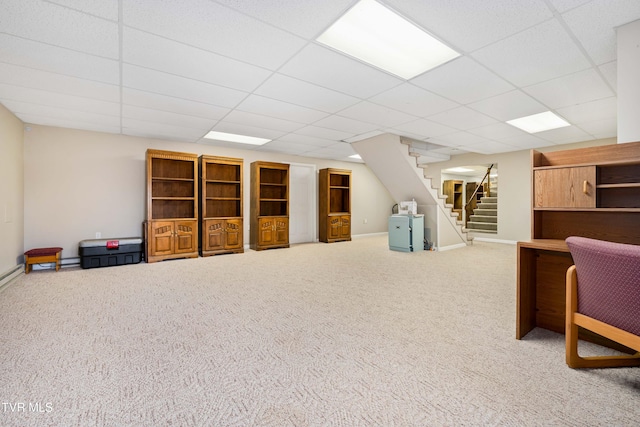 interior space with carpet flooring and a drop ceiling