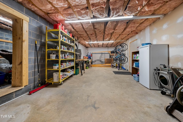 basement featuring white refrigerator