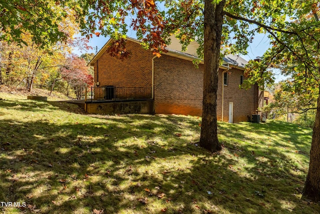 view of property exterior featuring a lawn