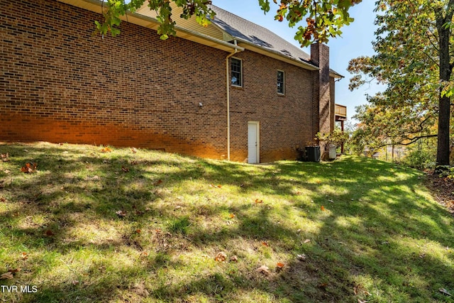 view of home's exterior featuring a lawn