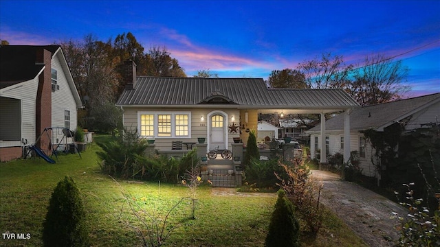 view of front of home featuring a yard