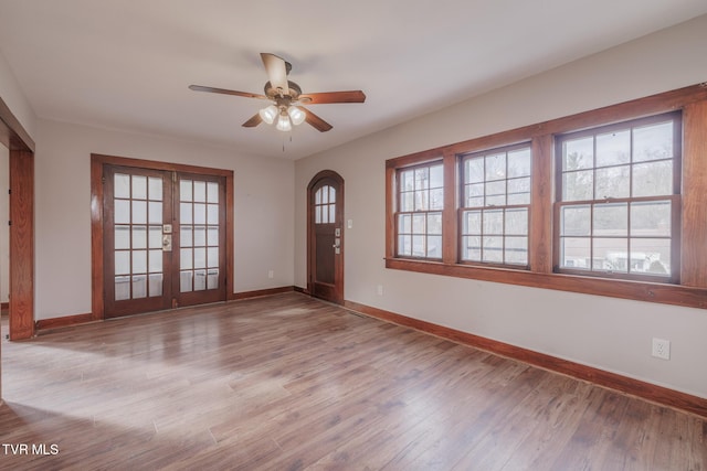 foyer featuring light hardwood / wood-style floors, french doors, and ceiling fan