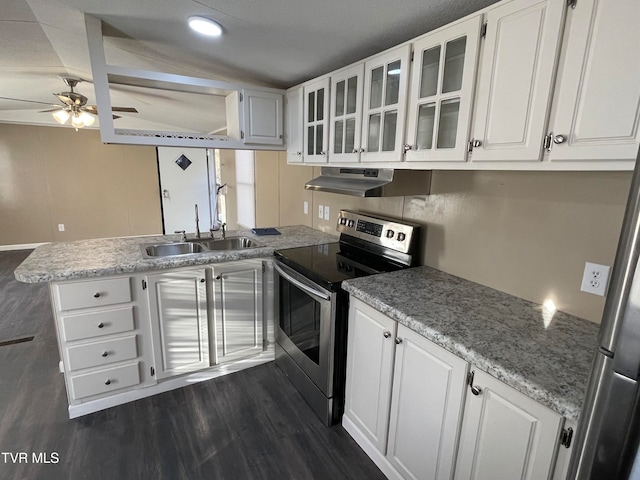 kitchen featuring stainless steel electric stove, extractor fan, white cabinetry, and kitchen peninsula