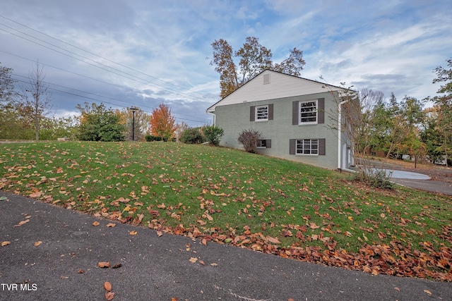 view of property exterior featuring a yard