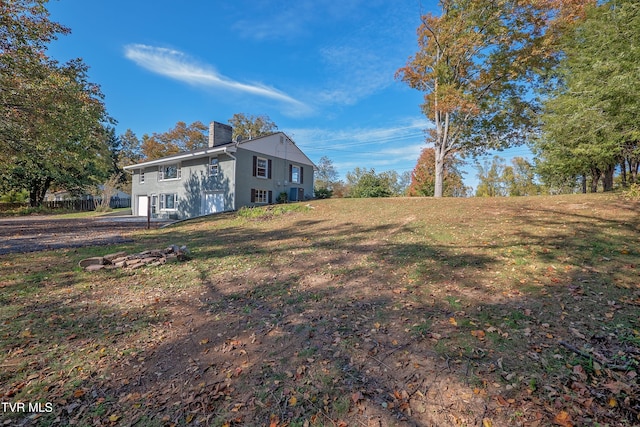 view of home's exterior with a yard