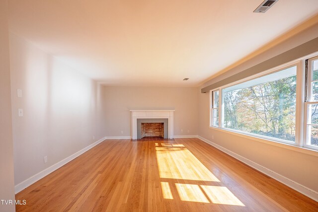 unfurnished living room featuring hardwood / wood-style floors