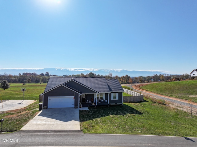 view of front facade featuring a front yard and a garage