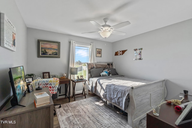 bedroom featuring ceiling fan and wood-type flooring