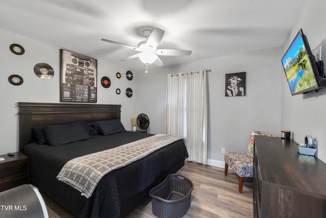 bedroom featuring hardwood / wood-style floors and ceiling fan