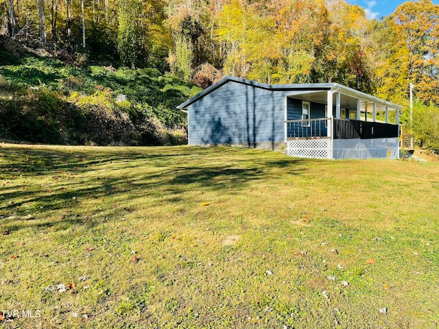 exterior space with a lawn and a porch