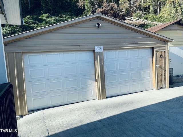 detached garage featuring radiator heating unit