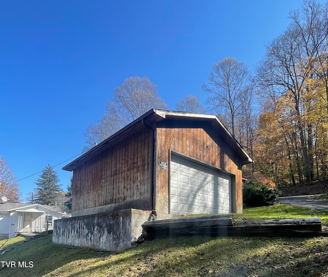 view of property exterior featuring a lawn