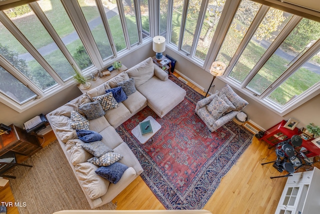 living room featuring a wealth of natural light and hardwood / wood-style floors