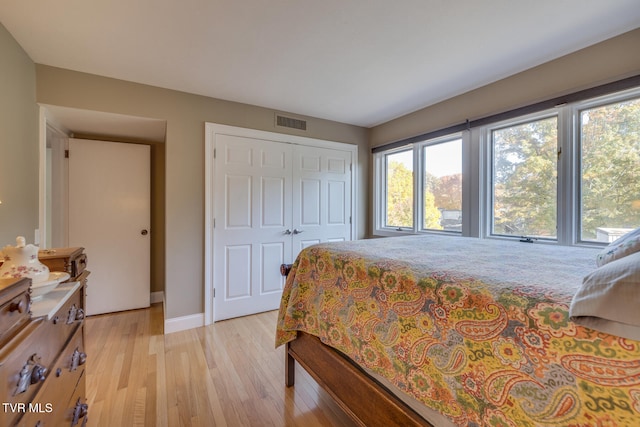 bedroom featuring a closet and light hardwood / wood-style floors