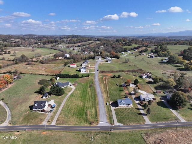 birds eye view of property featuring a rural view