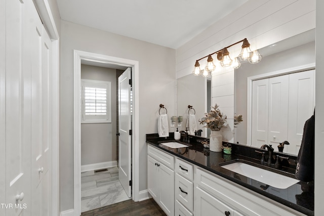 bathroom featuring vanity and hardwood / wood-style flooring