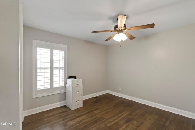 unfurnished room featuring dark hardwood / wood-style floors and ceiling fan