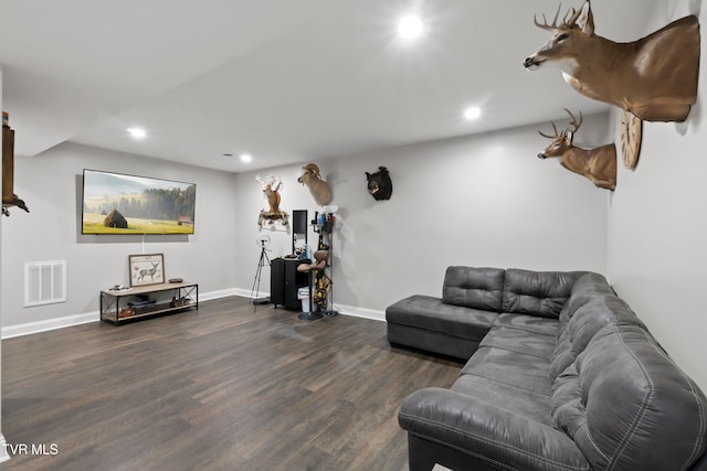 living room with dark hardwood / wood-style flooring