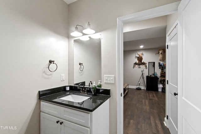 bathroom with vanity and hardwood / wood-style flooring