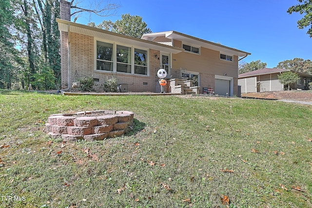 view of front of house with a front lawn and a garage