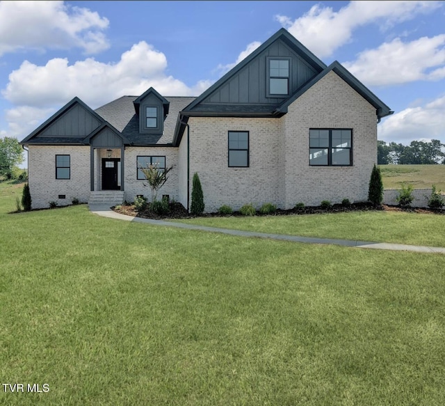633 Uncle Buddys Way, Jonesborough, TN 37659 - view of front of home with board and batten siding, a front yard, and brick siding