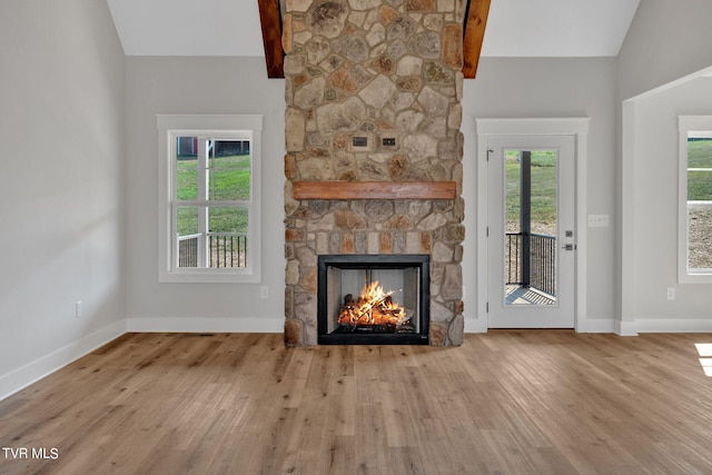 633 Uncle Buddys Way, Jonesborough, TN 37659 - unfurnished living room featuring lofted ceiling, wood finished floors, a fireplace, and baseboards