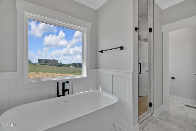 633 Uncle Buddys Way, Jonesborough, TN 37659 - full bath with marble look tiles, a freestanding tub, a shower stall, and a wainscoted wall