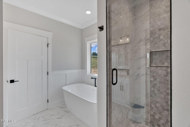 633 Uncle Buddys Way, Jonesborough, TN 37659 - full bath with a marble finish shower, a freestanding bath, marble look tiles, wainscoting, and a decorative wall
