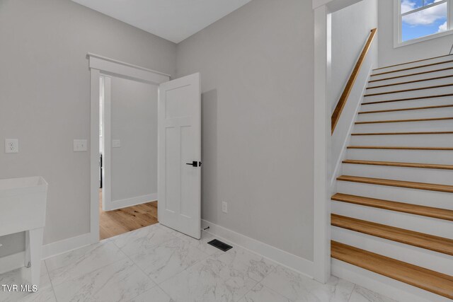 633 Uncle Buddys Way, Jonesborough, TN 37659 - stairway featuring marble look tiles and baseboards