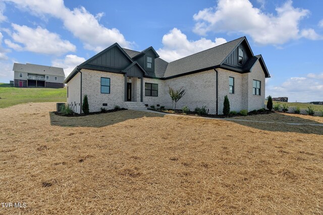 633 Uncle Buddys Way, Jonesborough, TN 37659 - view of front of property featuring board and batten siding, brick siding, and a front lawn
