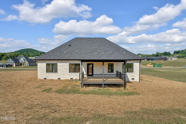 633 Uncle Buddys Way, Jonesborough, TN 37659 - back of house with brick siding, a yard, a deck with mountain view, and a shingled roof