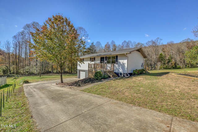 single story home with a front lawn and a garage