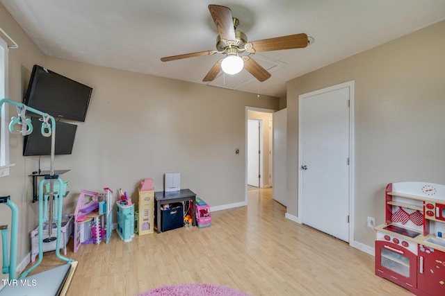 recreation room with light hardwood / wood-style flooring and ceiling fan