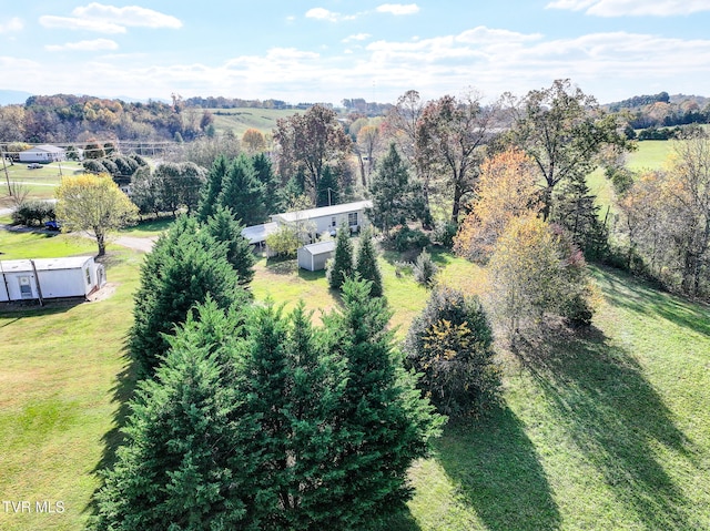 birds eye view of property with a rural view