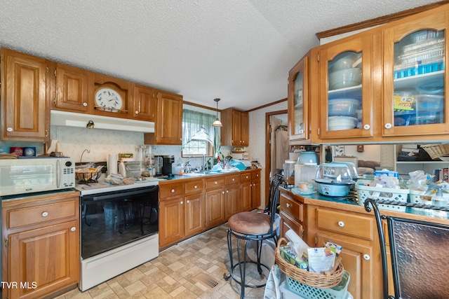 kitchen featuring a textured ceiling, sink, crown molding, decorative light fixtures, and white appliances