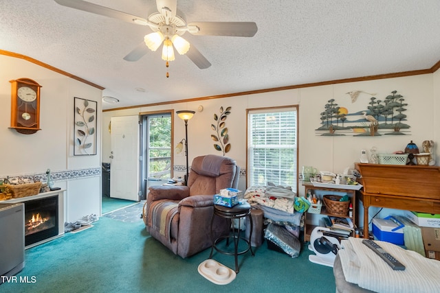 living room featuring carpet, a textured ceiling, a wealth of natural light, and ceiling fan