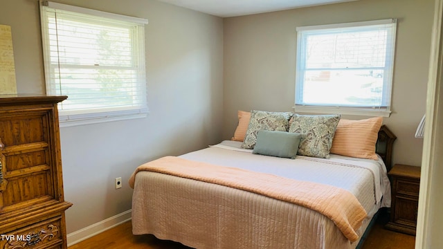 bedroom featuring dark hardwood / wood-style flooring