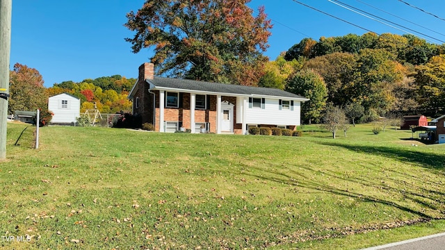 raised ranch with a front lawn