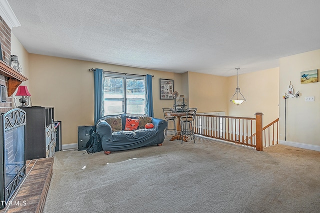 sitting room featuring carpet floors and a textured ceiling