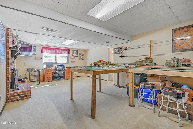 rec room featuring carpet and a drop ceiling