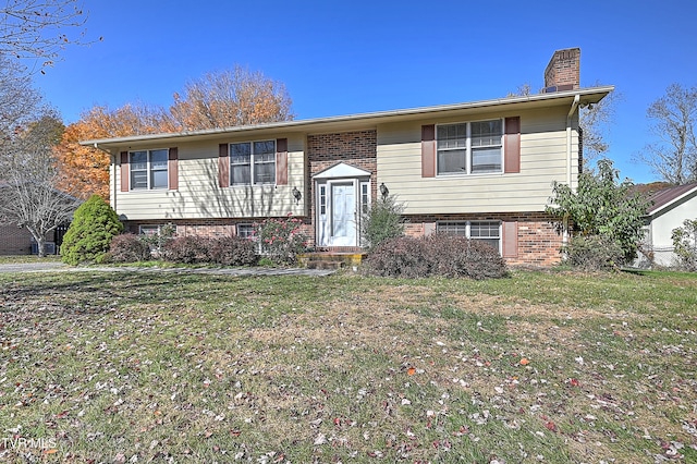 bi-level home with a front yard