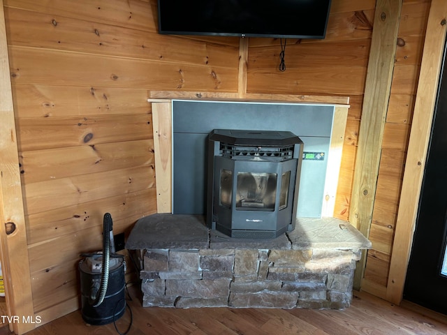 room details featuring wood walls and hardwood / wood-style floors