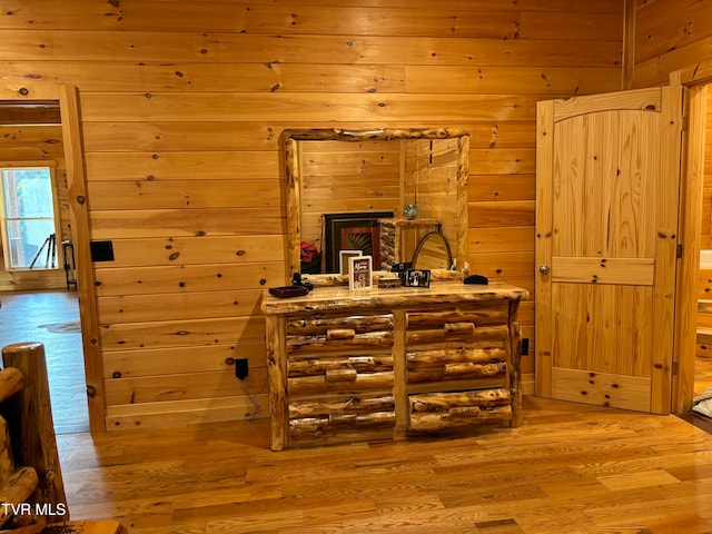 interior space featuring wood walls and hardwood / wood-style floors