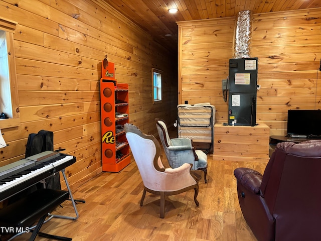 living area with wood ceiling, light hardwood / wood-style floors, and wood walls