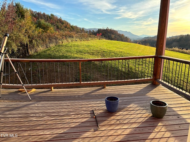 wooden deck with a mountain view