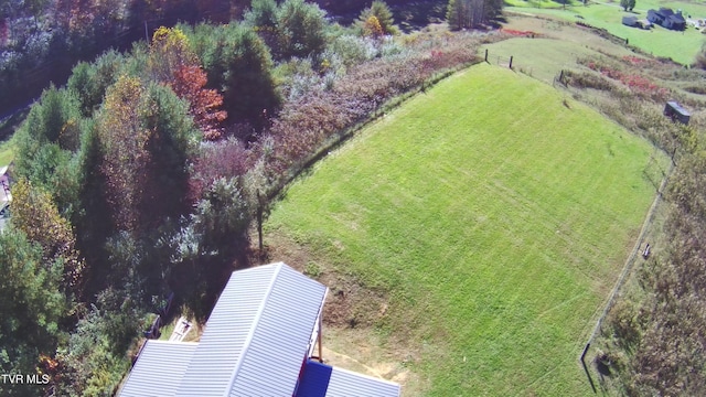 birds eye view of property with a rural view