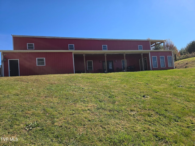 back of house with a yard