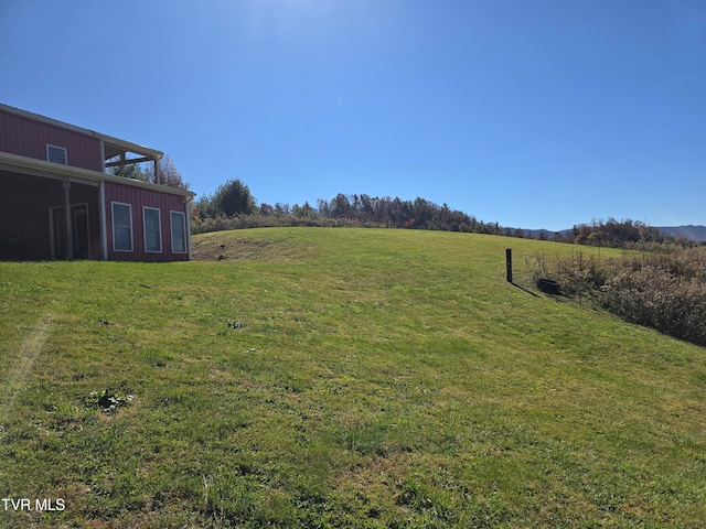 view of yard with a rural view