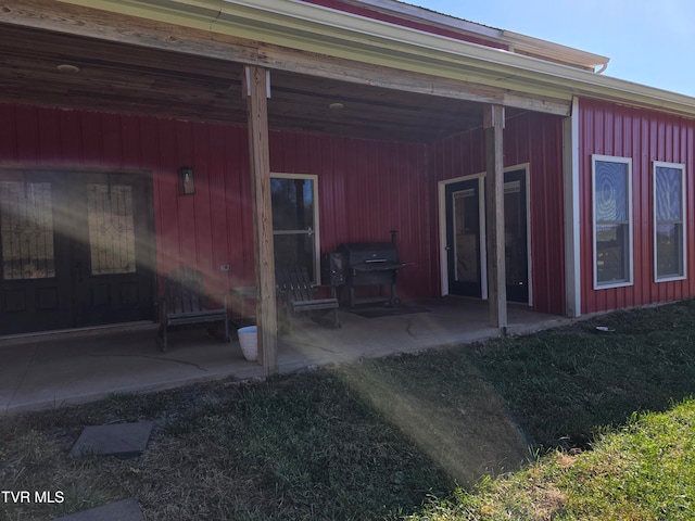 back of property with a patio