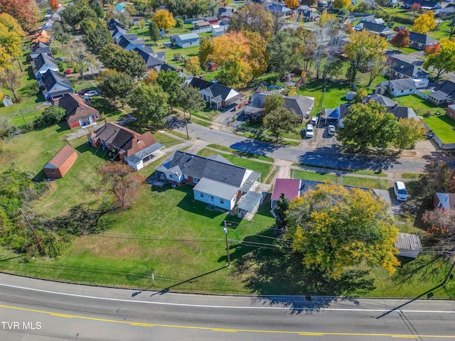 birds eye view of property with a residential view